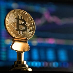 Image of a blockchain coin with blurry background.