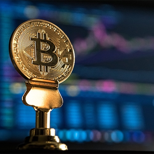 Image of a blockchain coin with blurry background.